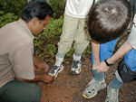 Applying tobacco powder to our shoes and socks - a leech preventative (hah!)