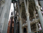 The nave again.  The nativity facade is stone and was completed in Gaudi's lifetime.  The nave was designed by Gaudi.  The columns and capitals are based on helicoids and elipsoids.  They're meant to look like a forest.  Now, there's a good deal of cement and rebar being used.