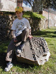 Young girl on ancient stone