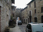 This is taken from inside the old wall looking out to the main road.  On the left is the barbershop