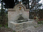 Water spigot with Mary on the top and trail marker on the right