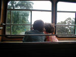 Duncan and Maggie "driving " the bus from the second deck