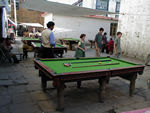 Pool seems to be mainly an outdoor occupation.  In many places, there were peaked, metal covers for the tables.