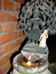 A shrine at the Kantipath hotel.  The hotel is filled with woodcarvings and nooks and crannies that are reminiscent of Nepalese homes and temples.  The little doll on the statue is one of many scattered around the hotel in obscure spots.  The staff gave a couple to Maggie, who was delighted, of course.