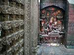 A 9th century carving of Shiva sitting with Parvati, her hand resting proprietorially on his knee, in the pose known as Uma Maheshwar.  