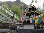 Prayer flags are everywhere.  Strung amidst the trees and partway up the slope, the flags give the place a cheerful, festive air.