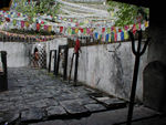 The trident symbol of Vishnu and prayer flags usually connected with Buddhism