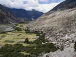 The green fields and mountains and town