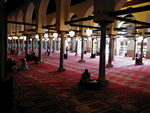 Prayer room.   When muslims pray, the imam leads the prayers and everyone else follows.  If muslims are not in a mosque, one of a small group will act as imam and lead the prayers.  The imam is  in front with the others, touching each other, behind him.  One reason for this originally was to protect the imam from anti-muslims.  