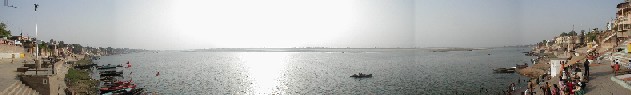 The Ganges really does curve at this point but not this much.  On the far right is Harishchandra Ghat, a burning ghat.  The orangish speck is the dress of a young girl who seems to help with the cremations.  Although our pictures tend to make things appear cleaner than they are.  