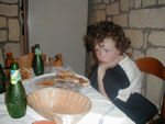 Tired girl contemplating pizza at one of the strangest places we have ever eaten.  